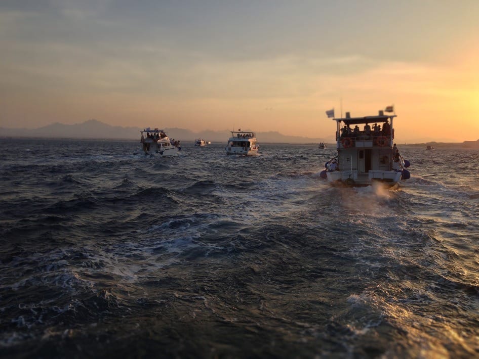 Boats on choppy water. Do you have your pleasure craft operator card?