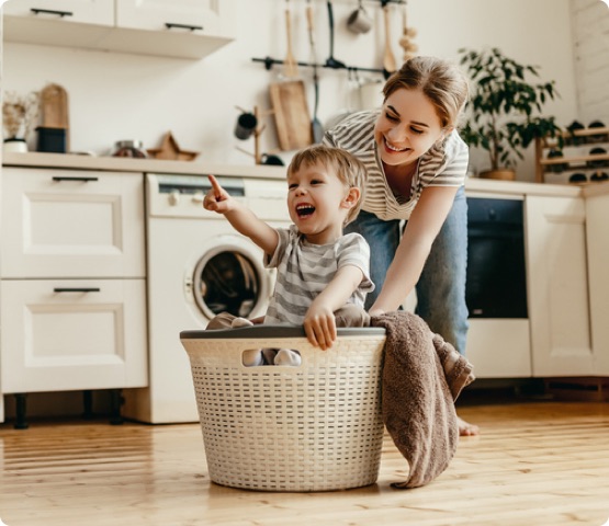 Mom and son having fun in kitchen at home