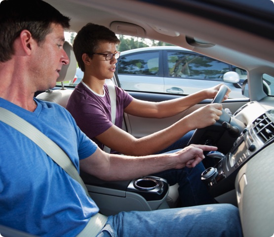 New, young driver gets instruction on how to drive